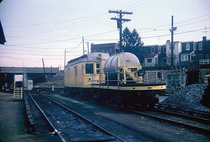 fp20.jpg - Utility Car 401 and the "pickle car" filled with fluid to prevent icing on the third rail awaits duty at the 72nd Street Norristown Line shop.