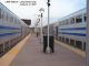 Two rush hour trains sit at the LIC station, our train is on the right.