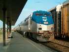 Amtrak #48, the Lake Shore Limited, arrives at Buffalo-Depew, New York, around an hour late. Note the auto carrier train to the right of the LSL. Depew had long trains of these cars in its small yard.