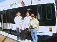 From left to right:  Alan Burden, Michael Korell, Kevin Korell, and Ellis Simon pose in front of an LRV at the HBLRTs West Side Avenue station.