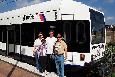 (From left to right) John Corbett, Michael Korell, Kevin Korell, and Ellis Simon pause at the West Side Avenue station in Jersey City, in front of Hudson-Bergen light rail (HBLRT) car #2008, whose operator has just switched ends to return to Hoboken Terminal. (Alan Burden photo)