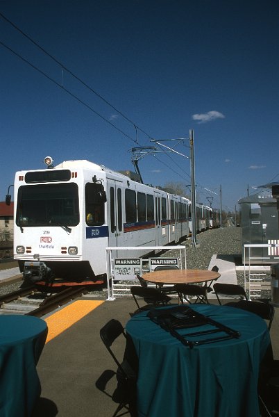 20130181-rtd.jpg - Picnic on a platform.  Celebration events at the Lakewood-Wadsworth Station included an area set up with tables at the east end of the platform where RTD volunteers provided information and goodies. (4/26/13)